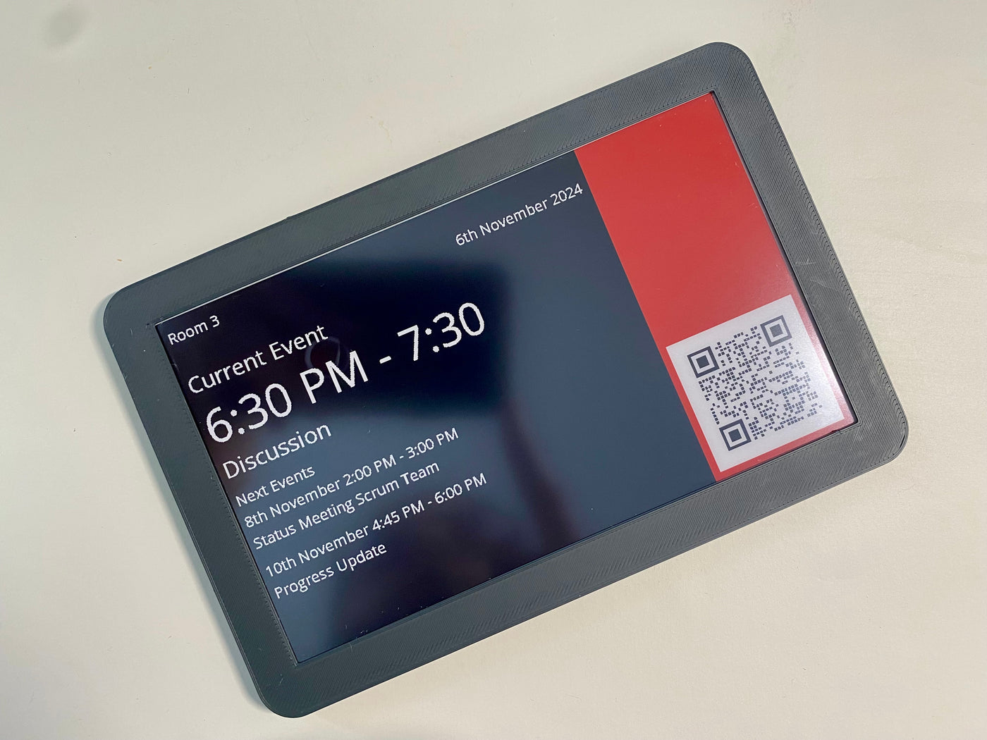 Front view of InkyPanel showing an e-paper dashboard